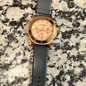 Marc by Marc Jacobs rose gold watch with grey leather band.